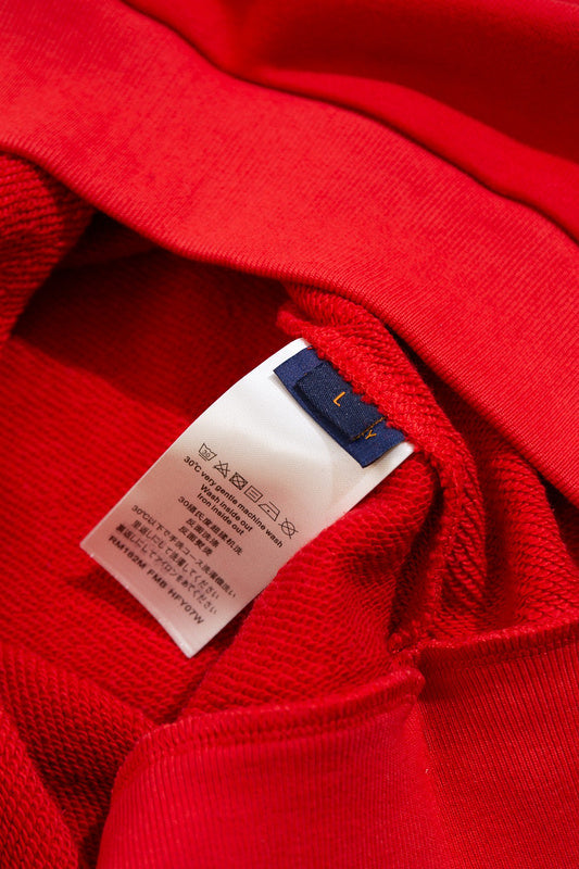 Side profile of Louis Vuitton luxury clothing with logo-detail design