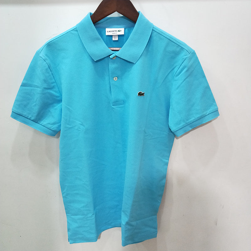 Front view of Lacoste luxury clothing with monogram-inspired silhouette