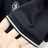 Flat lay presentation of Moncler luxury clothing with logo-detail design