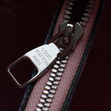 Handle and strap detail of sleek modern women's handbag – women's statement bag