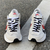Side profile of Nike bold contrast sneakers sleek tonal finish