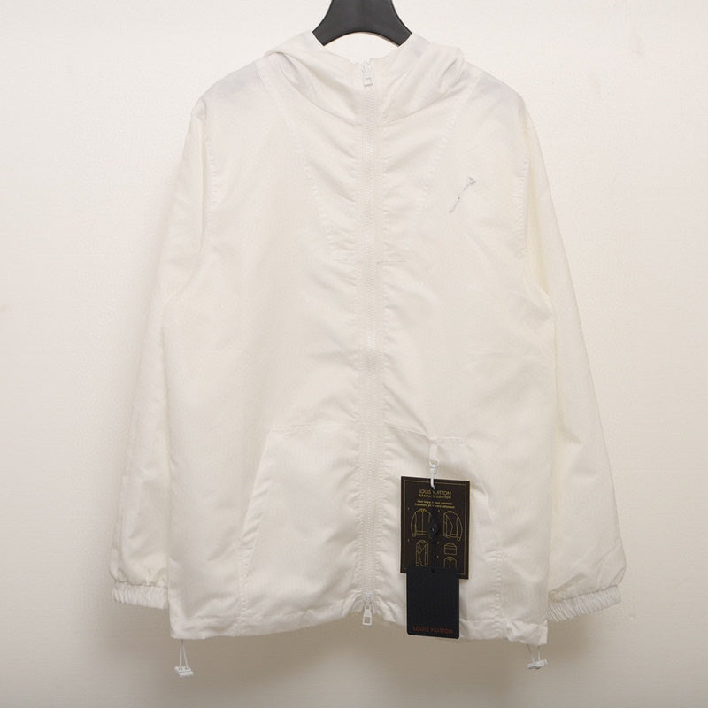 Close-up detail shot of Louis Vuitton luxury clothing with logo-detail design