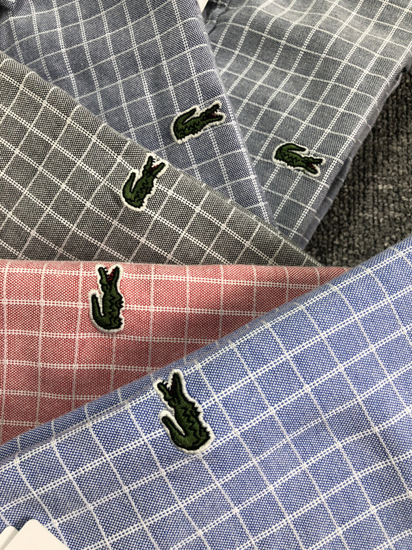 Side profile of Lacoste luxury clothing with logo-detail design