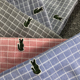 Side profile of Lacoste luxury clothing with logo-detail design