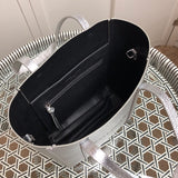 Side profile of statement modern women's handbag – women's everyday handbag