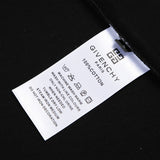 Close-up detail shot of Givenchy luxury clothing with signature branding