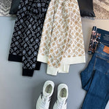 Close-up detail shot of Louis Vuitton luxury clothing with monogram-inspired silhouette