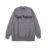 Close-up detail shot of Louis Vuitton luxury clothing with label-forward styling