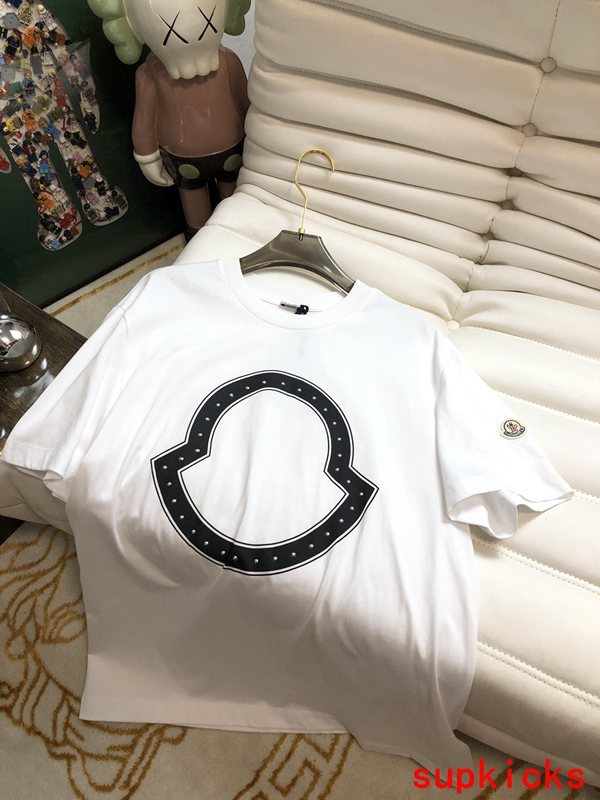 Close-up detail shot of Moncler luxury clothing with monogram-inspired silhouette