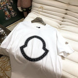 Close-up detail shot of Moncler luxury clothing with monogram-inspired silhouette