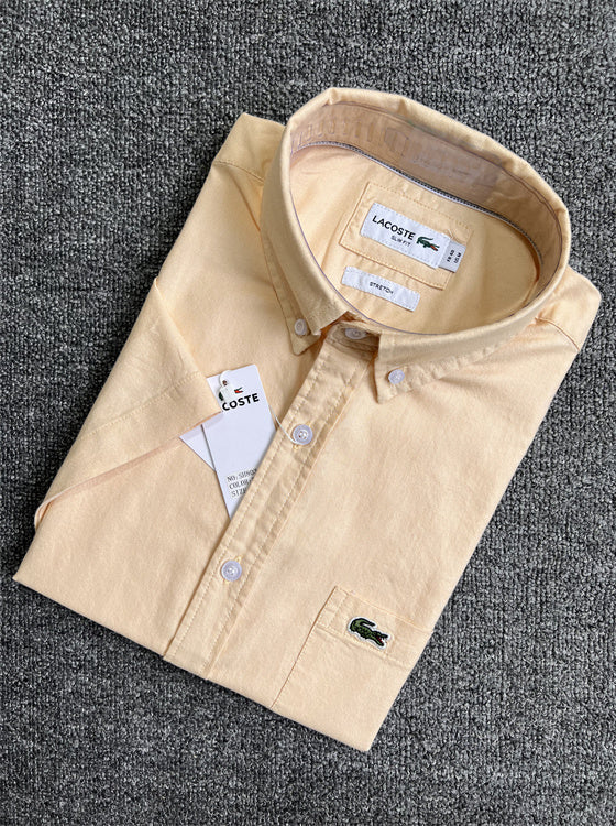 Flat lay presentation of Lacoste luxury clothing with logo-detail design