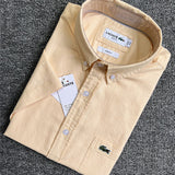 Flat lay presentation of Lacoste luxury clothing with logo-detail design