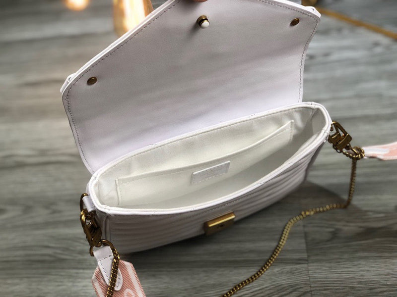 Side profile of sleek chic women's handbag – women's luxury accessory
