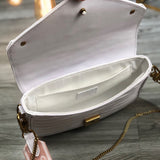 Side profile of sleek chic women's handbag – women's luxury accessory