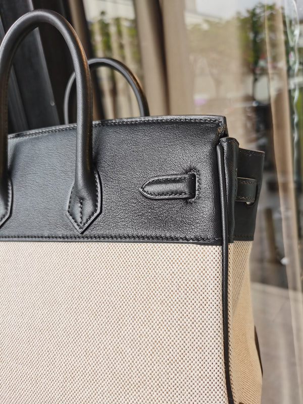 Side view of sleek structured handbag