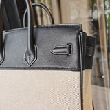 Side view of sleek structured handbag