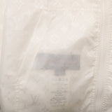 Close-up detail shot of Louis Vuitton luxury clothing with logo-detail design