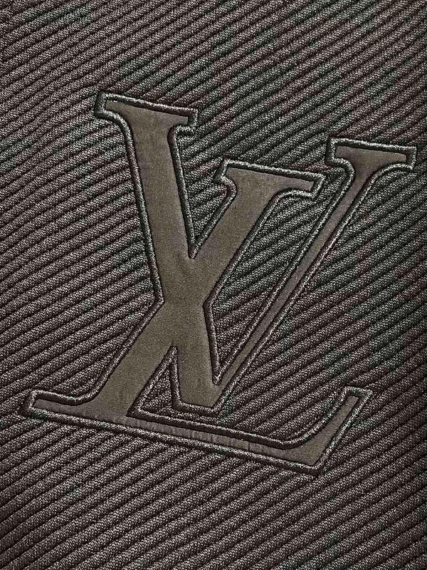 Flat lay presentation of Louis Vuitton luxury clothing with monogram-inspired silhouette