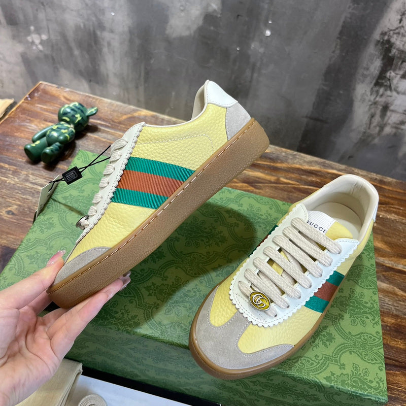 Side profile of Gucci fresh white-and-black sneakers minimalist modern build