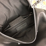 Side profile of premium chic women's handbag – women's luxury accessory
