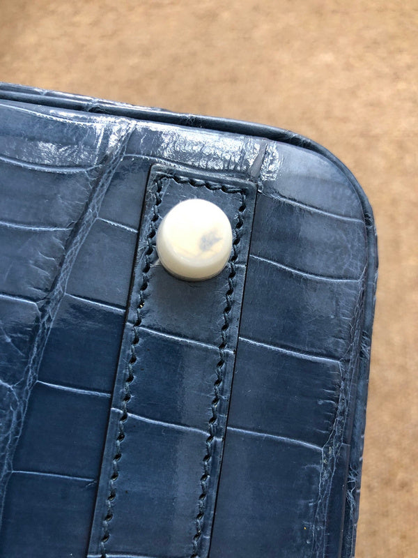 Side view of polished structured handbag