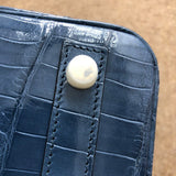 Side view of polished structured handbag