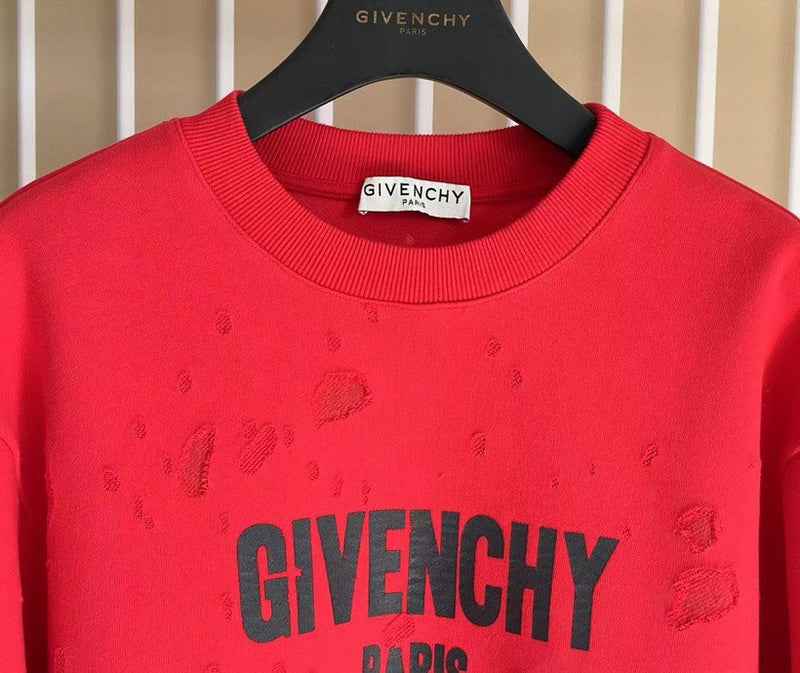 Close-up detail shot of Givenchy luxury clothing with logo-detail design