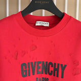 Close-up detail shot of Givenchy luxury clothing with logo-detail design