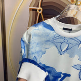 Back view of Louis Vuitton luxury clothing with signature branding