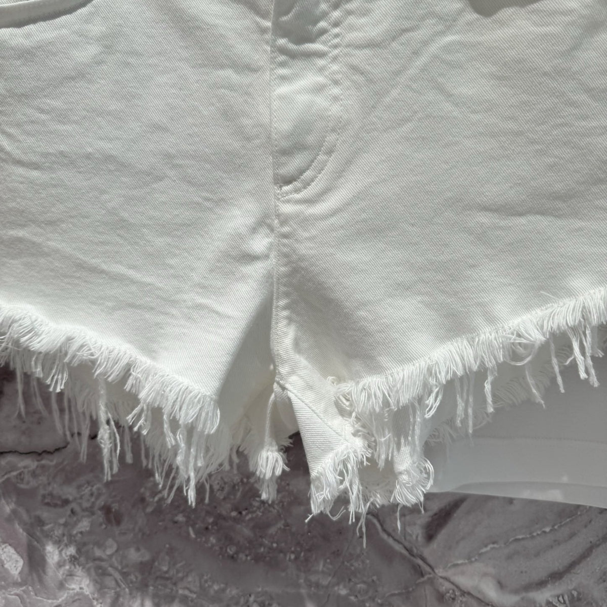 Dolce & Gabbana Shorts flat lay on neutral background