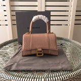 Styled lifestyle shot of polished elevated women's handbag – women's luxury accessory