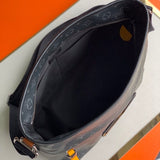 Handle and strap detail of everyday-luxe polished women's handbag – women's designer-style accessory