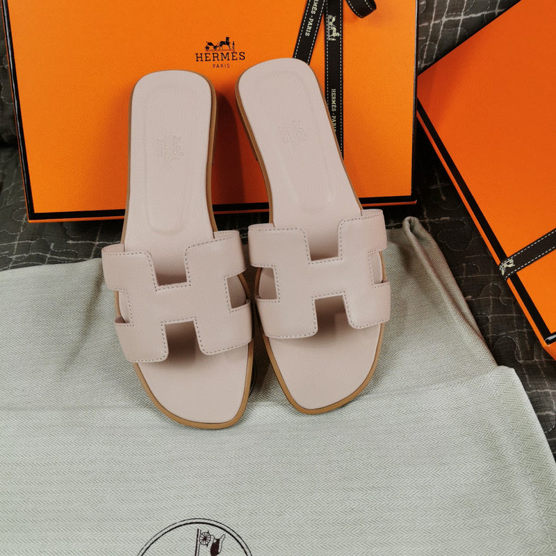 Hermès Chocolate Brown Flat Thong Sandals - Close-Up Texture View