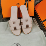 Hermès Chocolate Brown Flat Thong Sandals - Close-Up Texture View