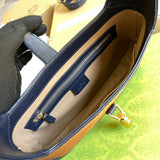 Side profile of polished structured women's handbag – women's designer-style accessory