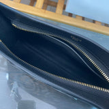 Styled lifestyle shot of refined polished women's handbag – women's luxury handbag