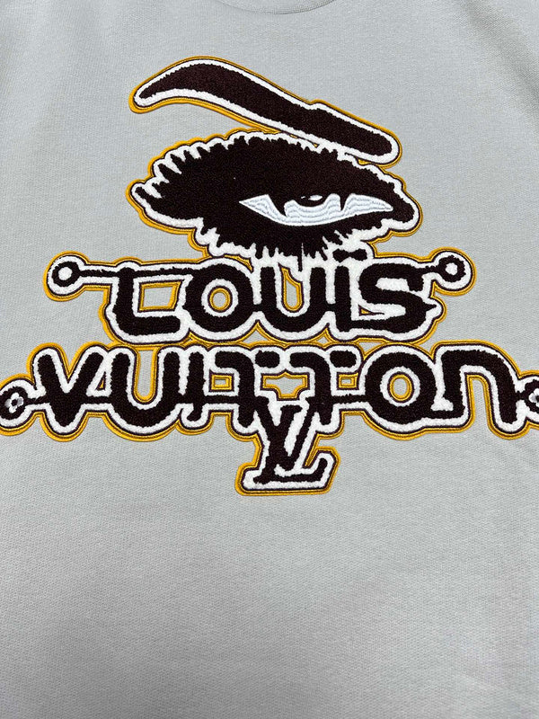 Full styled look of Louis Vuitton luxury clothing with monogram-inspired silhouette