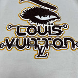 Full styled look of Louis Vuitton luxury clothing with monogram-inspired silhouette