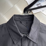 Close-up detail shot of Louis Vuitton luxury clothing with contemporary cut