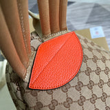 Close-up detail of classic signature women's handbag – women's statement bag