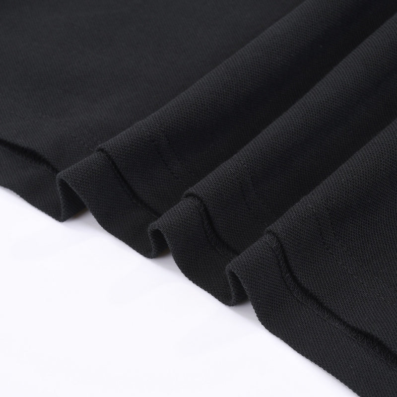 Close-up detail shot of Polo cotton polo shirt with monogram-inspired silhouette