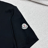 Full styled look of Moncler luxury clothing with monogram-inspired silhouette