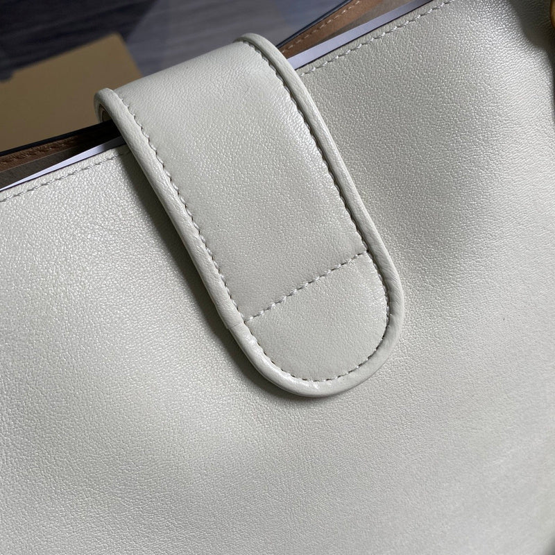Styled lifestyle shot of modern classic women's handbag – women's luxury handbag
