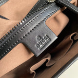 Side profile of refined structured women's handbag – women's luxury accessory