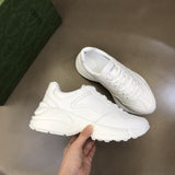Gucci Designer sneakers in bold contrast signature lace-up style front view