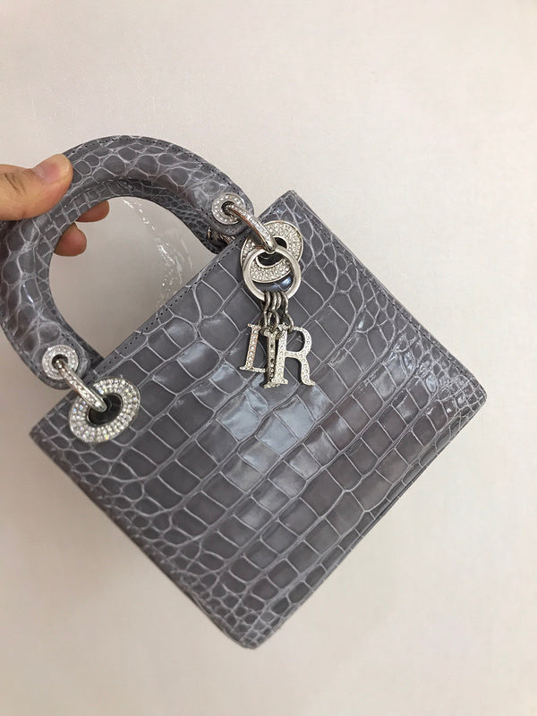 Side profile of signature sleek women's handbag – women's designer-style accessory