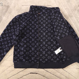Close-up detail shot of Louis Vuitton luxury clothing with tailored silhouette
