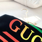 Close-up detail shot of Gucci luxury clothing with logo-detail design