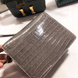  Clean-Lined top-handle bag carried on shoulder 16