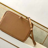 Styled lifestyle shot of modern structured women's handbag – women's luxury accessory